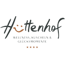 Logo des Hüttenhof mit dem Schriftzug 'Wellness, Kuscheln & Glücksmomente'.