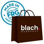 Braune Einkaufstasche mit dem Logo von Blach Modehaus und einem blauen 'Made in FRG'-Stempel.